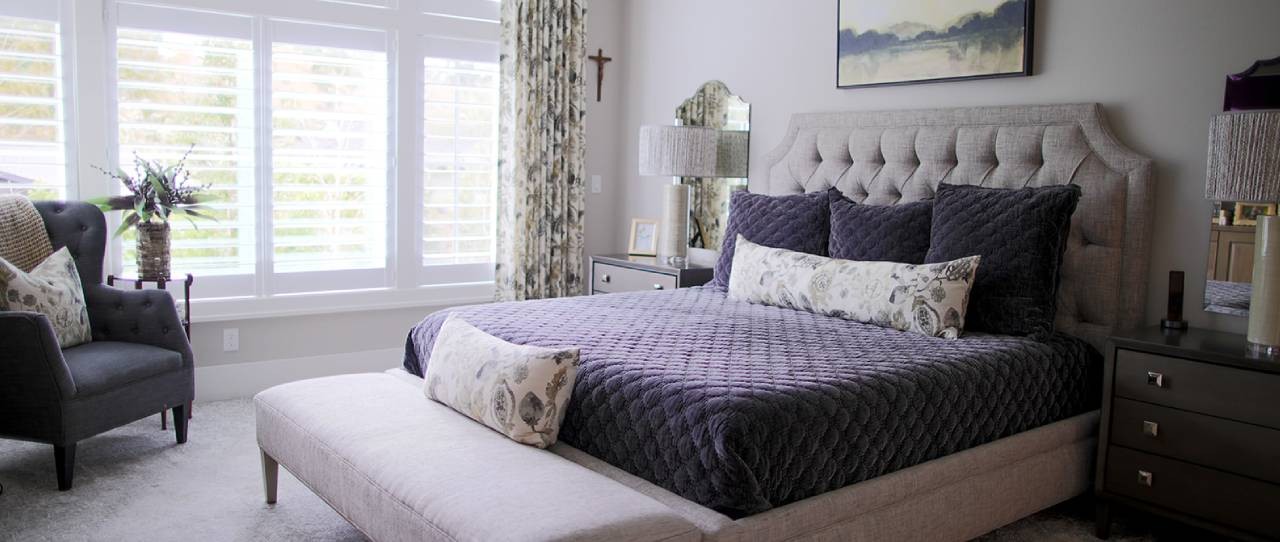 Purple custom bedding in a bedroom